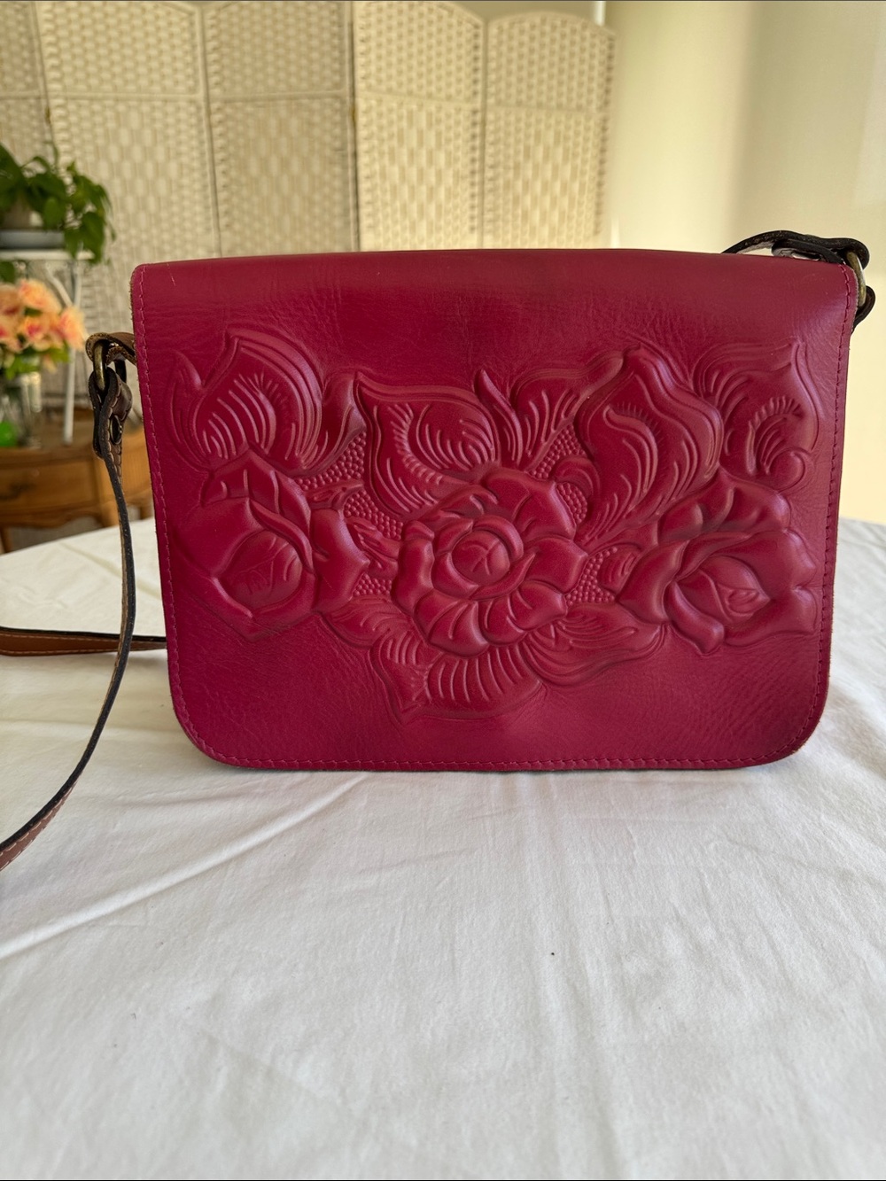 Patricia Nash Rose-Embossed Leather Crossbody in Berry. 11x8.5x3.5”